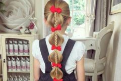 Модная коса для школьниц с бантиками