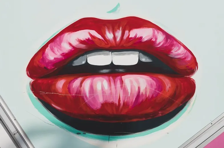 Намальовані соковиті губи, які символізують оральні пестощі
